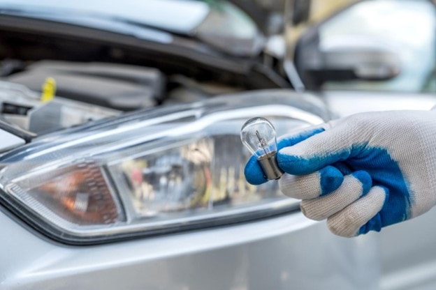 Professional Worker Changing Halogen Light Bulbs.jpg