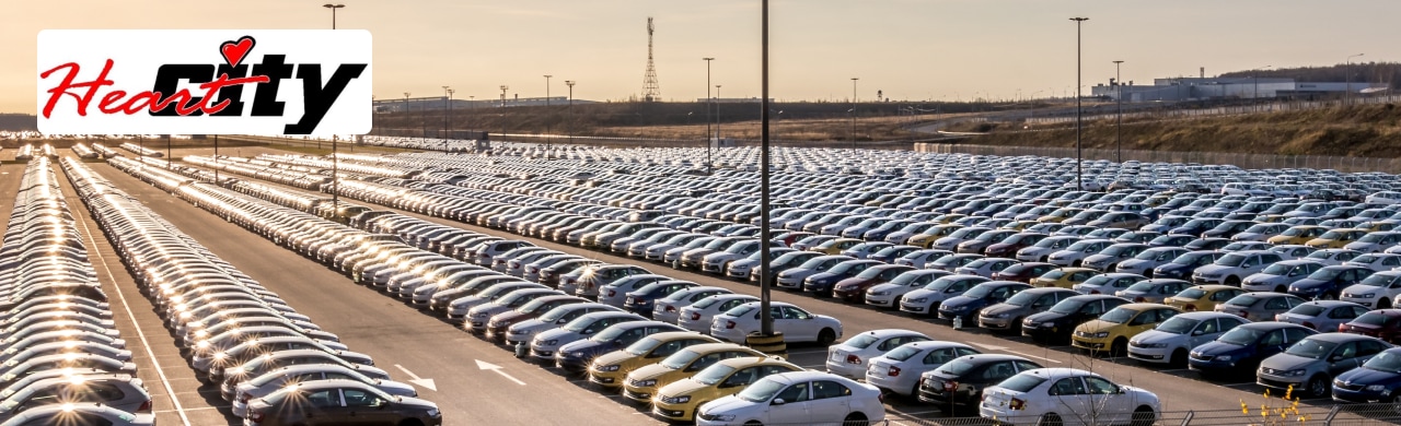 A vast expanse of parked cars, showcasing Heart City Toyota's extensive inventory.