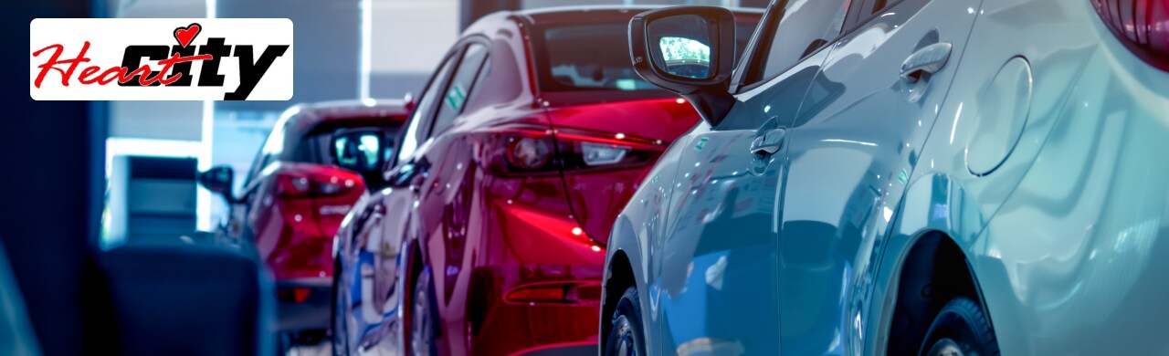 Heart City Toyota dealership showcasing a modern showroom with Toyota vehicles parked in front.