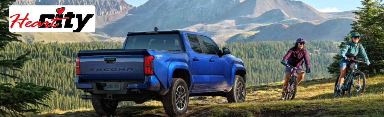 Toyota-Tacoma-Tough-Rugged-and-Ready-for-Every-Job1.png A Toyota Tacoma conquering a rugged off-road trail near Elkhart's scenic countryside.