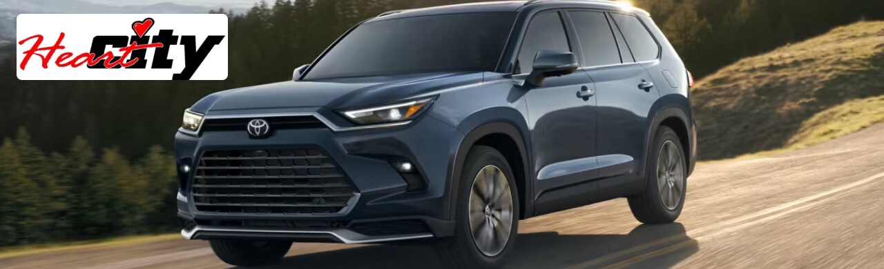 A sleek SUV driving through a scenic landscape showcasing its power and versatility.