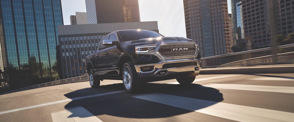 2019 Ram 1500 A black Ram 1500 driving through a city