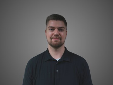 Staff member Alex Serak from ID_e6c96f8e1099