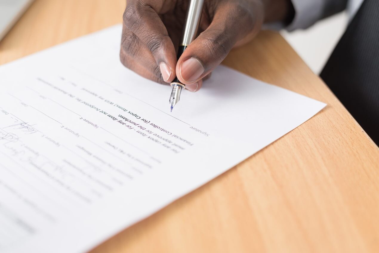 Signing paperwork.png