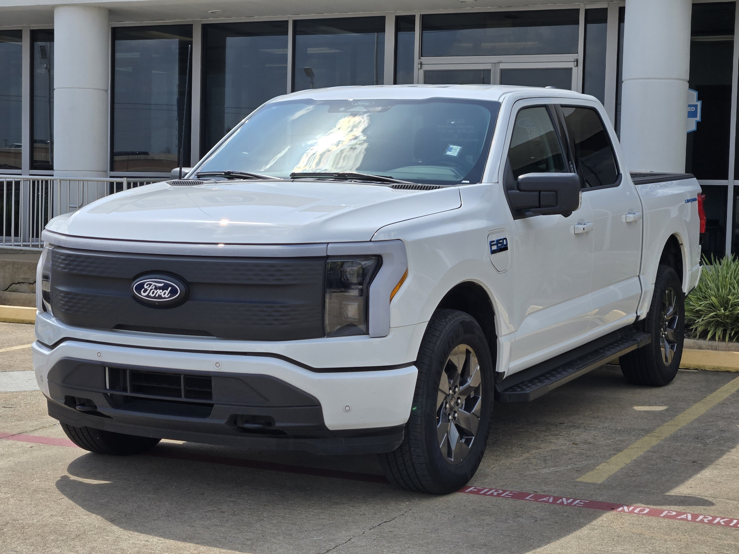 Used 2024 Ford F-150 Lightning Flash with VIN 1FT6W3L78RWG25954 for sale in Meadows Place, TX