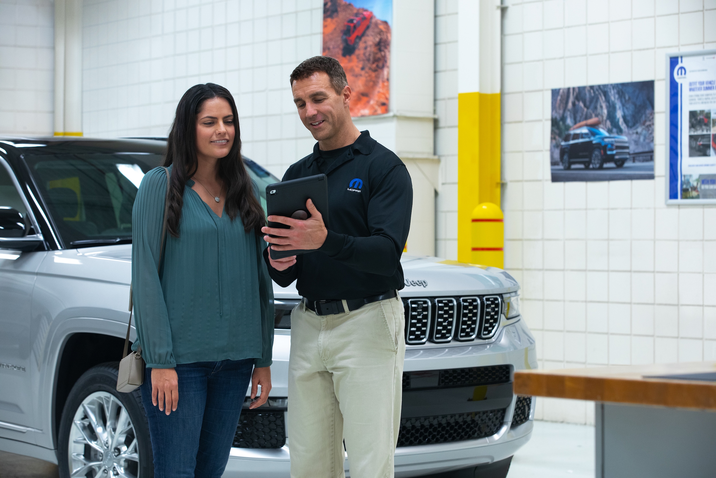  Person cheerfully signing documents.