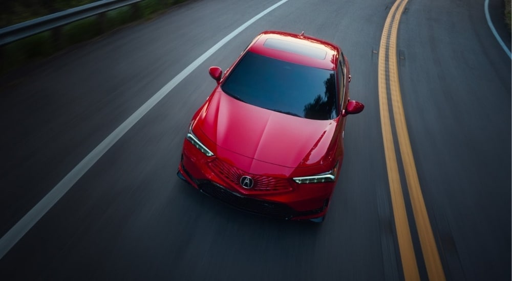 2026%20Acura%20Integra%20-%20Highway%202.jpg Red 2026 Acura Integra for sale driving on a highway