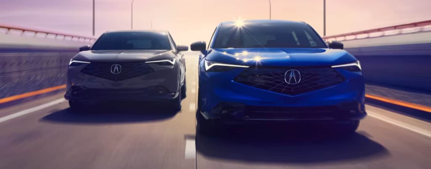 Blue 2026 Acura ADX driving next to a white 2-26 Acura ADX
