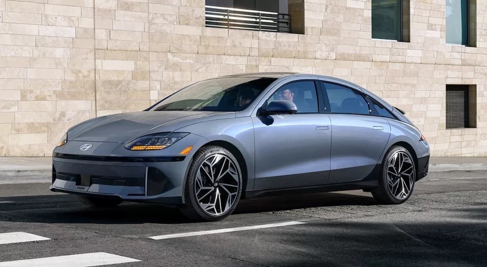 A grey 2024 Hyundai Ioniq 6 is shown from the front at an angle.