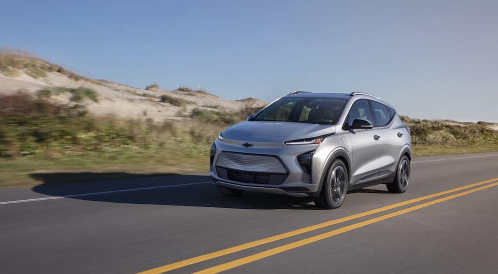 A silver 2023 Chevy Bolt EUV is shown from the front at an angle after leaving a car dealership in Atlanta, GA.