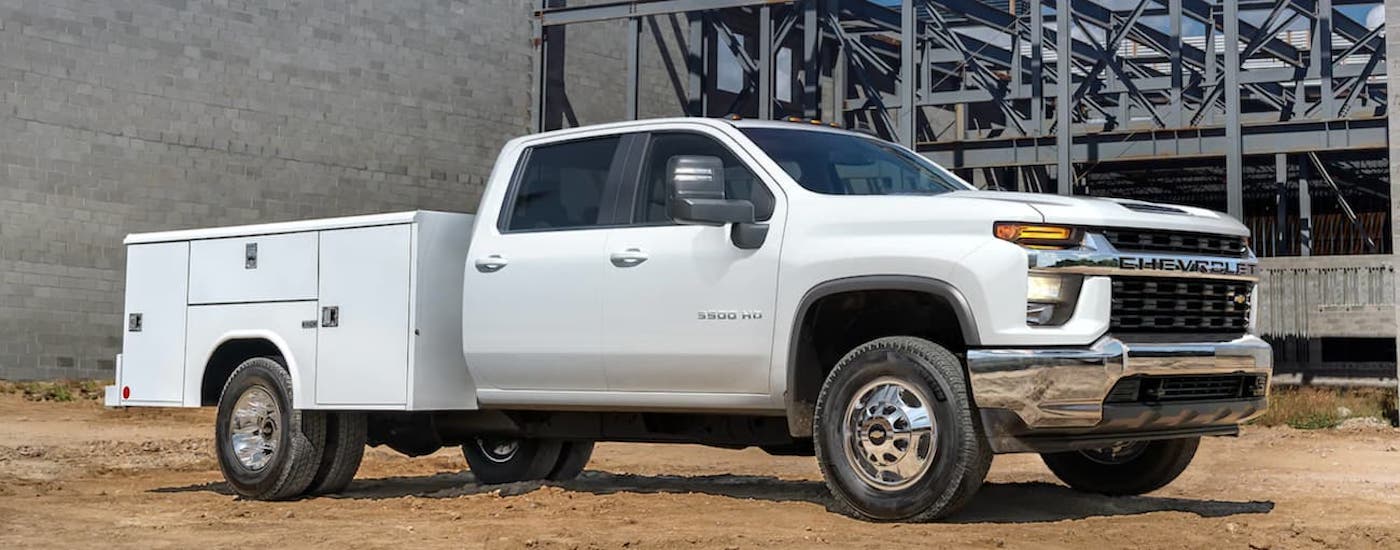 A white 2021 Chevy Silverado 3500 HD is shown from the side.
