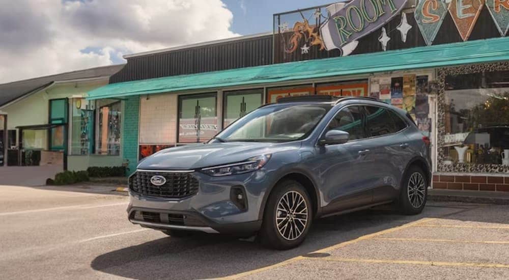 Grey 2026 Ford Escape parked outside of a brick building