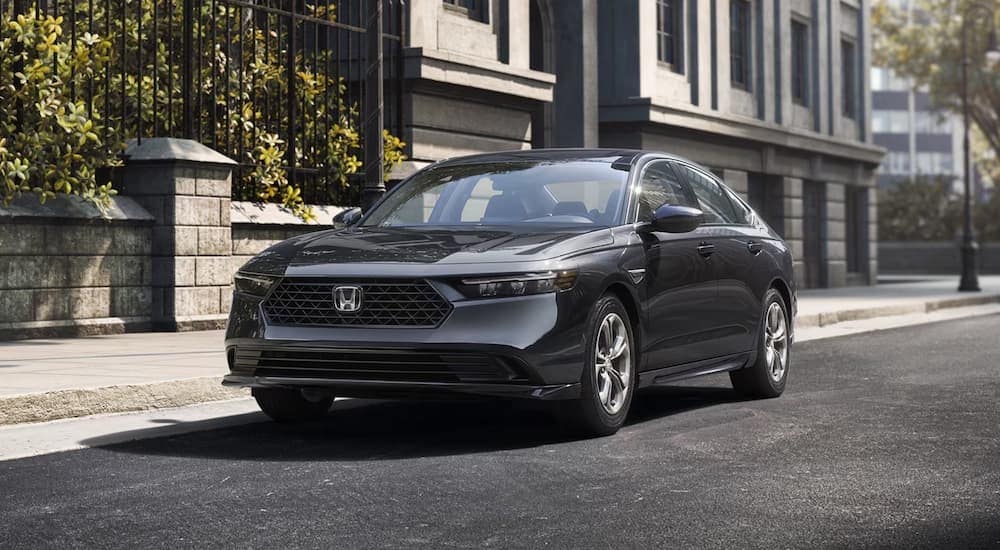 A gray 2026 Honda Accord Hybrid parked in a city