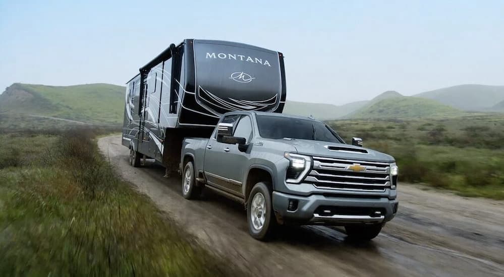 Car%20dealer%20near%20Charleston%20-%202025%20Chevy%20Silverado%202500%20HD%20High%20Country%20-%20Trailer.jpg A gray 2025 Chevy Silverado 2500 High Country is shown towing a trailer.