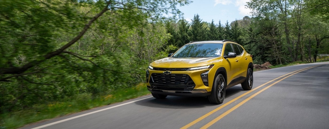 A yellow 2025 Chevy Trax from the front at an angle.