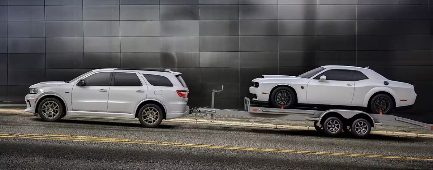 White 2025 Dodge Durango driving to a SUV dealership near Wilmington