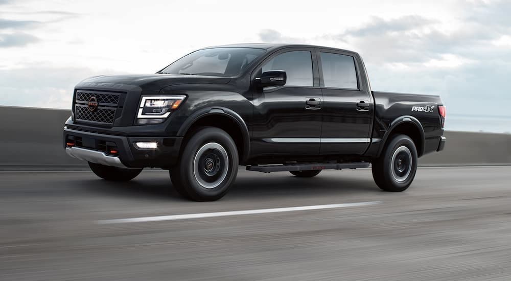 used%20cars%20for%20sale%20in%20Charlotte%20-%202023%20nissan%20titan%20crew%20cab%20pro-4x%20-%20black%20(1).jpg A black 2023 Nissan Titan PRO-4X is shown driving to view used cars for sale in Charlotte.