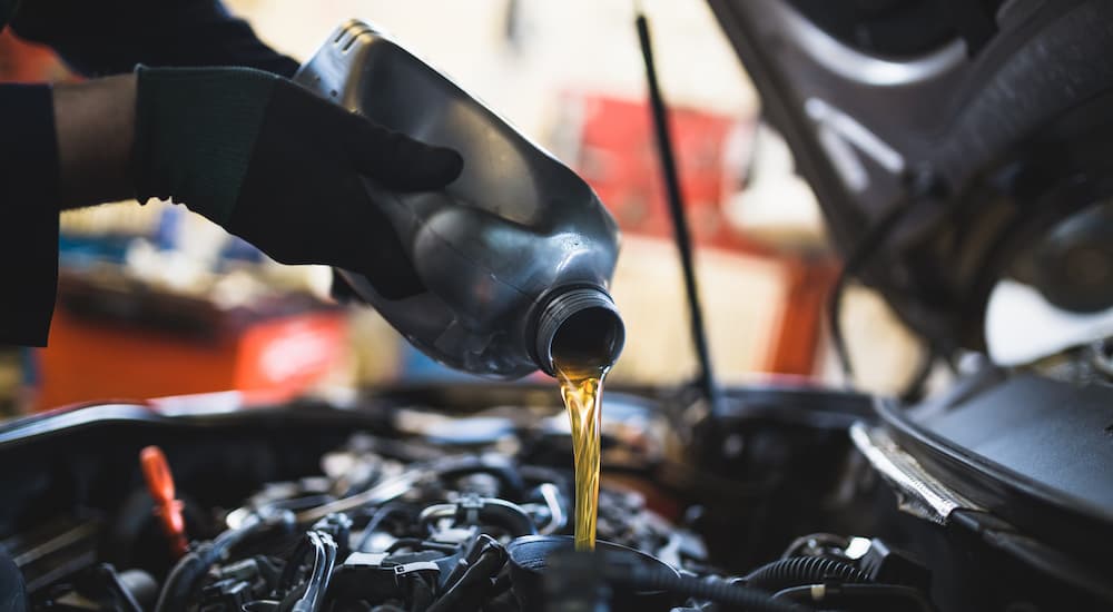 Auto%20Service%20in%20Atlanta%20-%20Oil%202.jpg Oil is shown being poured into an engine during an auto service in Atlanta.