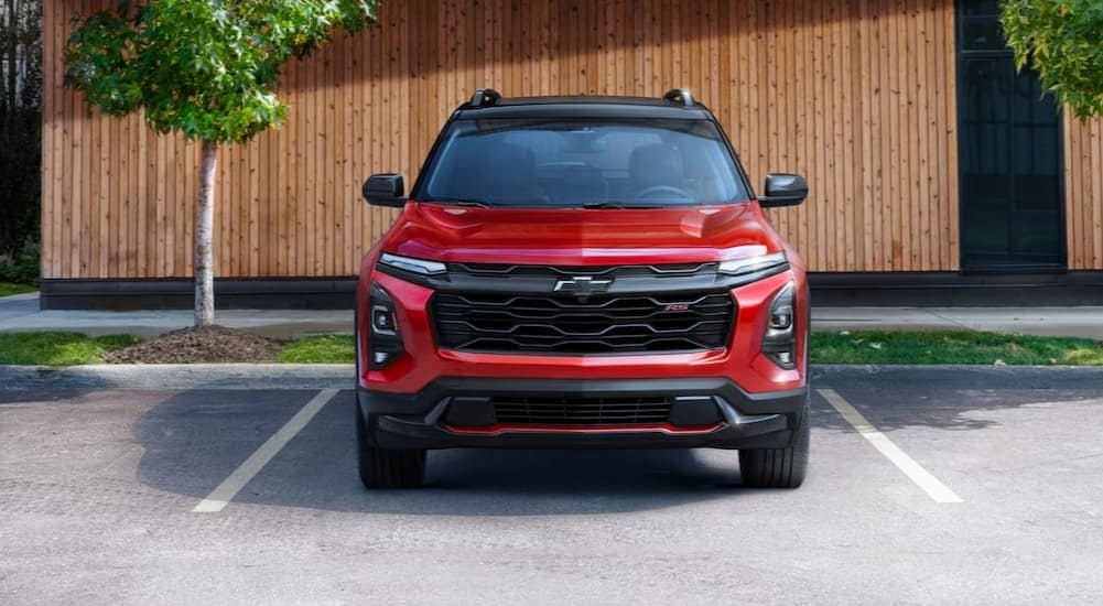 car%20dealer%20near%20Marietta%20-%202025%20Chevy%20Equinox%20RS%20-%20Tree.jpg A red 2025 Chevy Equinox RS is shown parked on a sunny day.