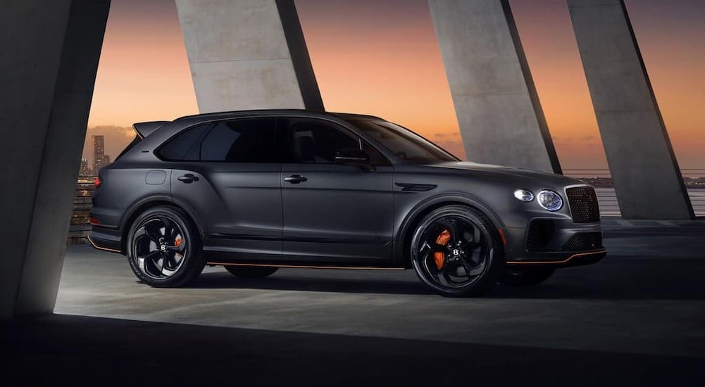 A black 2024 Bentley Bentayga is shown parked between pillars.