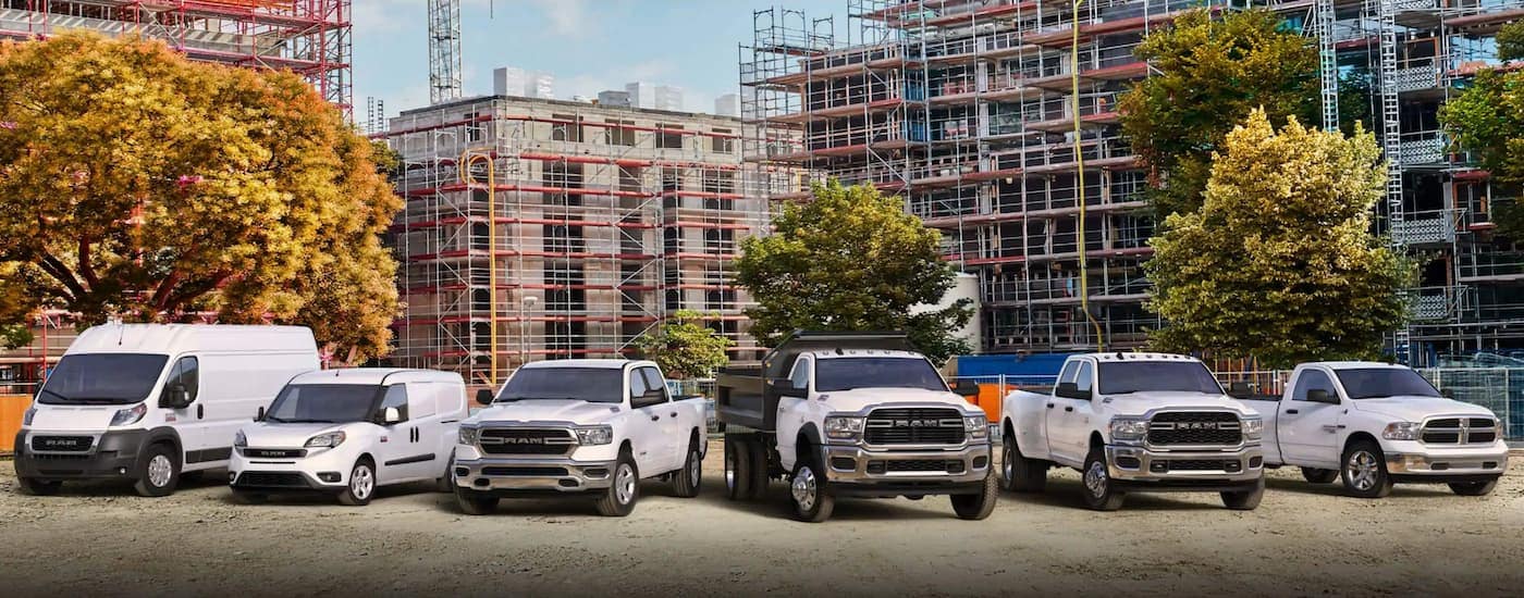A fleet of white Ram commercial trucks are shown after leaving a dealer that offers commercial truck sales near Wilmington.