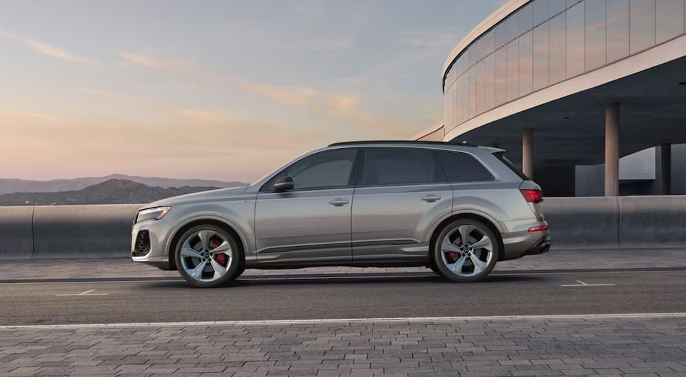 Side of a 2025 Audi Q7 parked outside of a dealership