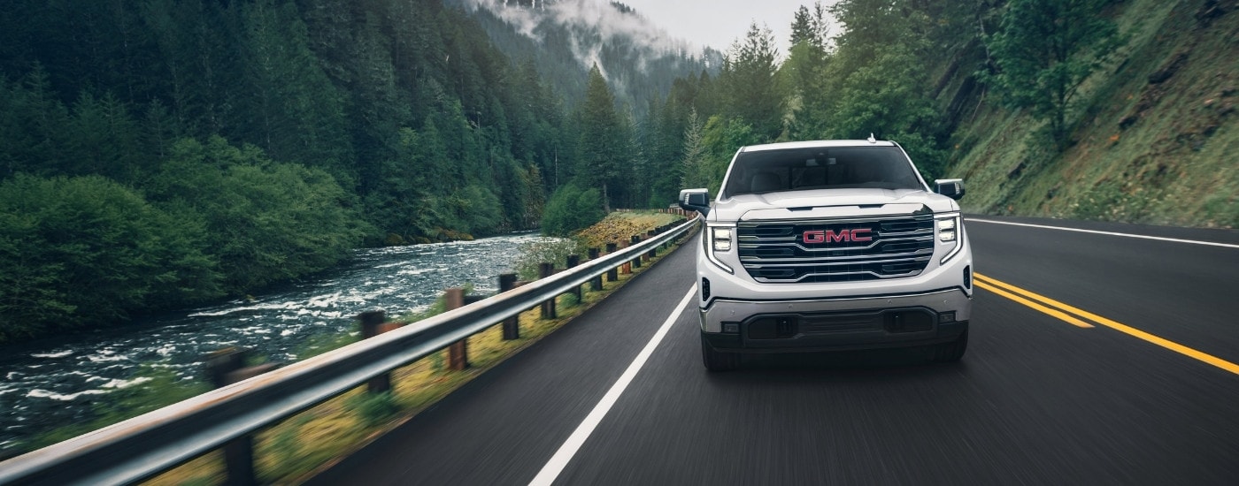 A white 2024 GMC Sierra 1500 from the front after leaving a dealer that has trucks for sale near Charlotte.