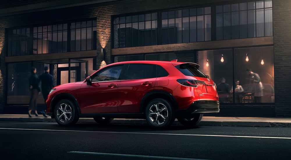 Raleigh%20Cars%20for%20Sale%20-%202025%20Honda%20HR-V%20-%20Red.jpg Rear view of a red 2025 Honda HR-V parked by a curb after visiting a dealer with Raleigh cars for sale.