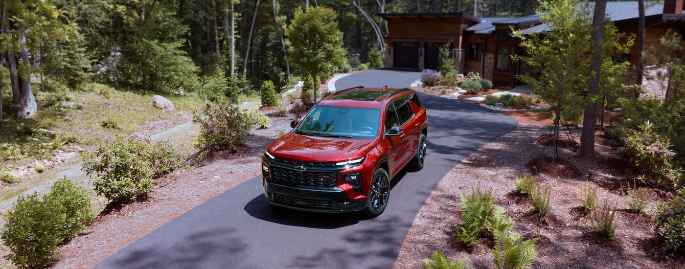 A red 2024 Chevy Traverse RS is shown from the front at an angle after leaving an SUV dealership near Charlotte.