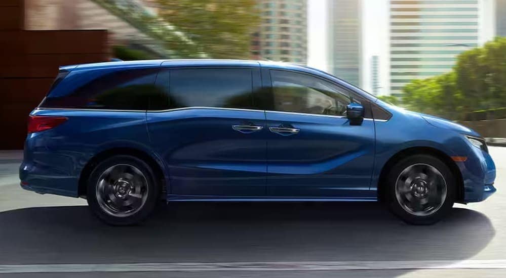 used%20cars%20for%20sale%20near%20Durham%20-%202024%20Honda%20Odyssey%20Elite%20-%20Blue.jpg A blue 2024 Honda Odyssey driving to view used cars for sale near Durham.