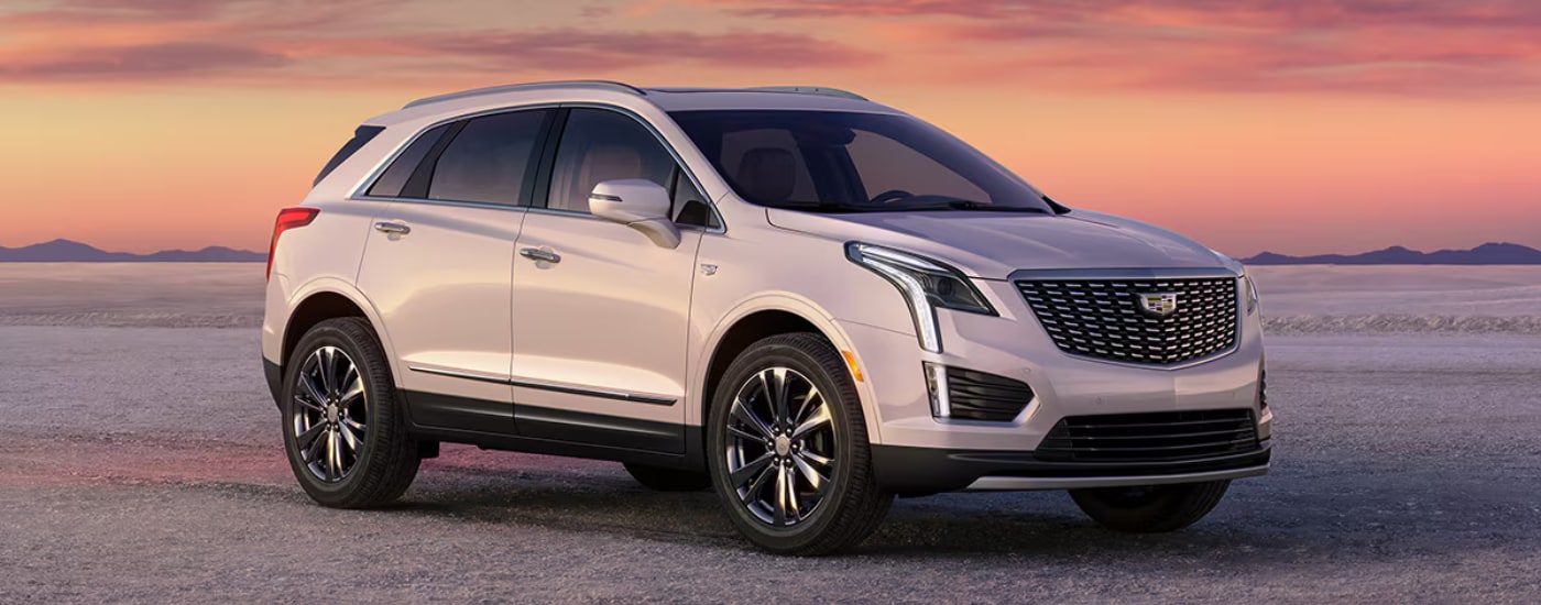 White 2026 Cadillac XT5 parked off-road at an angle