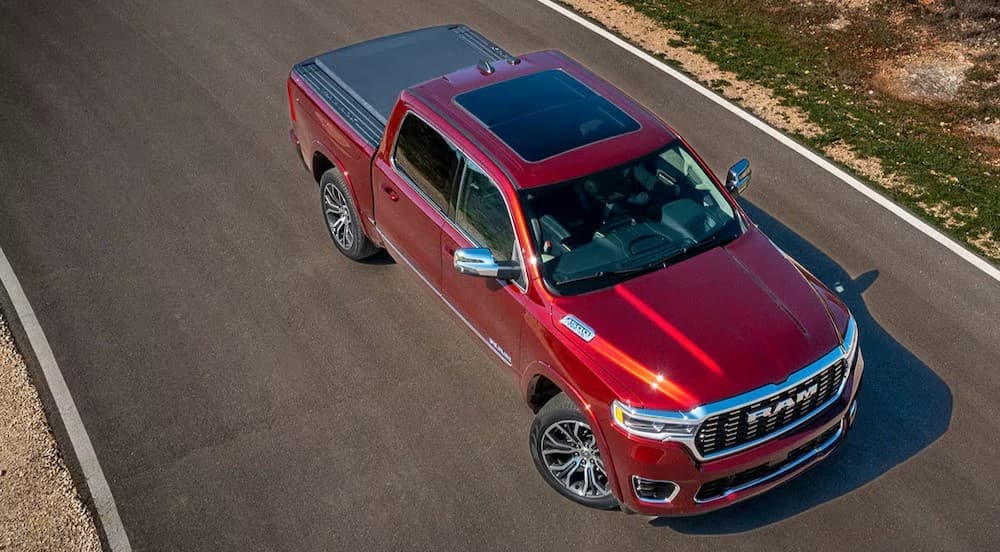 Car%20dealer%20near%20Charleston%20-%202025%20Ram%201500%20-%20Aerial.jpg A red 2025 Ram 1500 is shown parked on a backroad.
