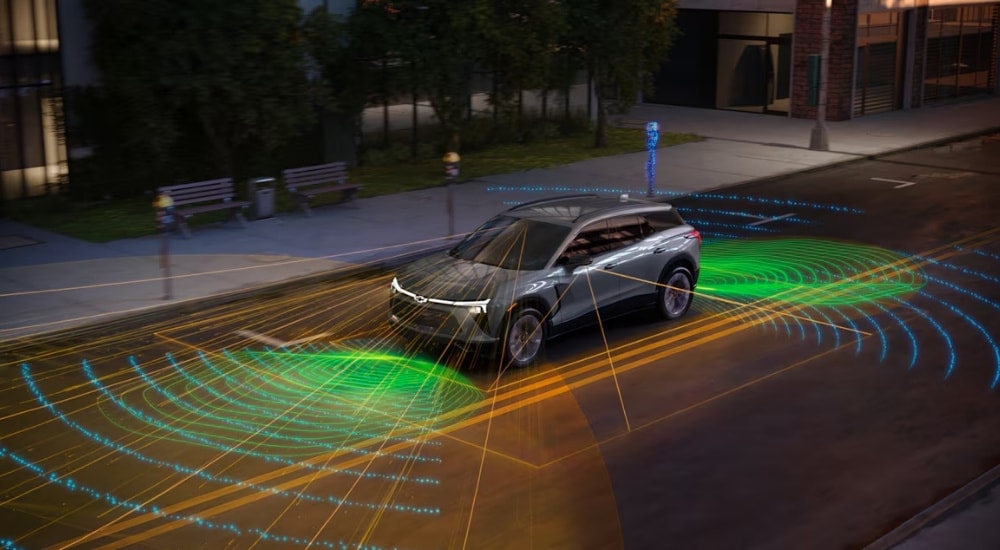 Simulated sensor lines coming from a grey 2024 Chevy Blazer EV