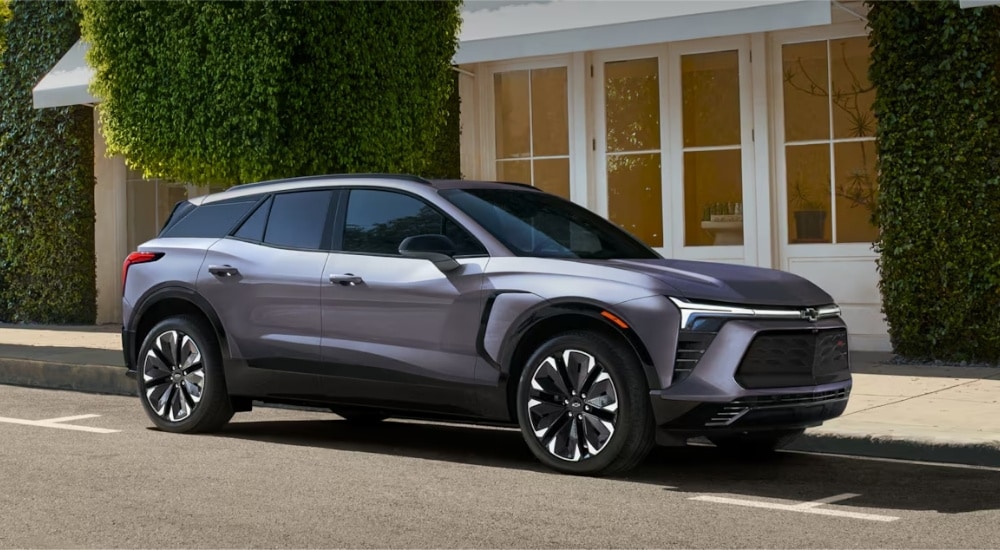 Grey 2026 Chevy Blazer EV parked by a curb.