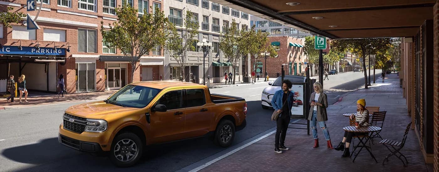 A yellow 2022 Ford Maverick is shown from the front at an angle.