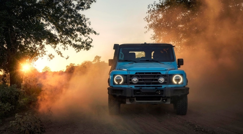 Blue 2025 INEOS Grenadier  kicking up dust