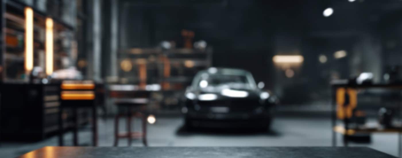 A blurred image of a car mechanic garage.