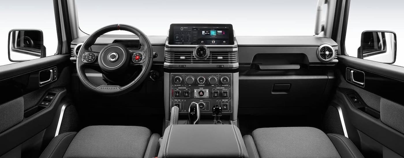 The black and gray interior and dash in a 2025 INEOS Grenadier Station Wagon.