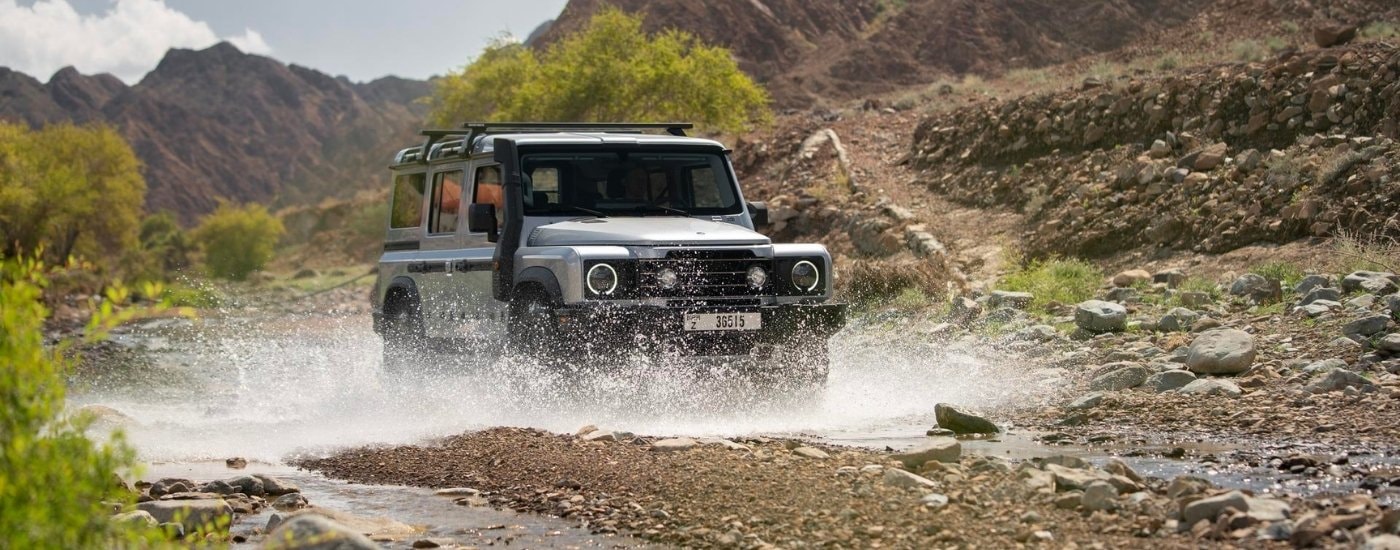 A grey 2025 INEOS Grenadier Station Wagon off-roading.