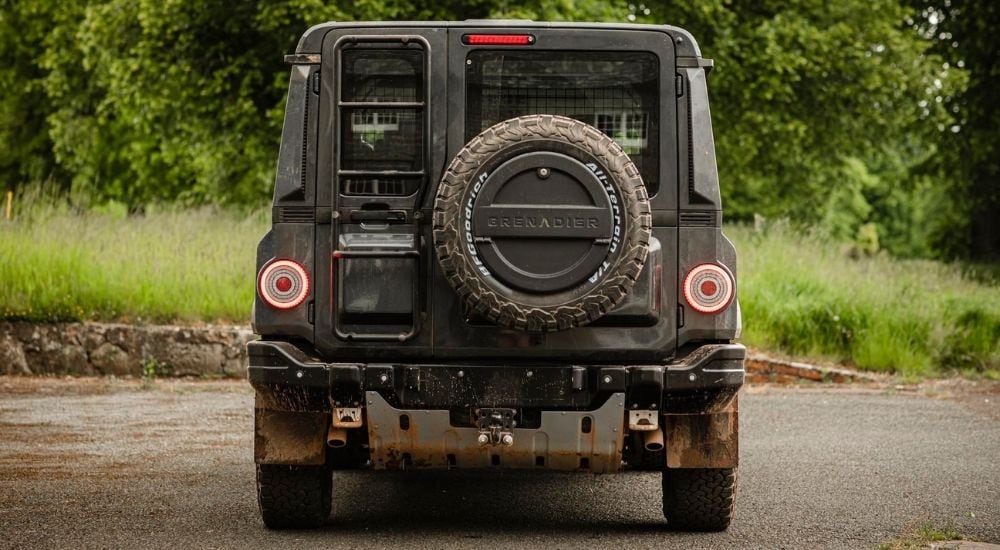 Rear view of an INEOS Grenadier parked in a lot.