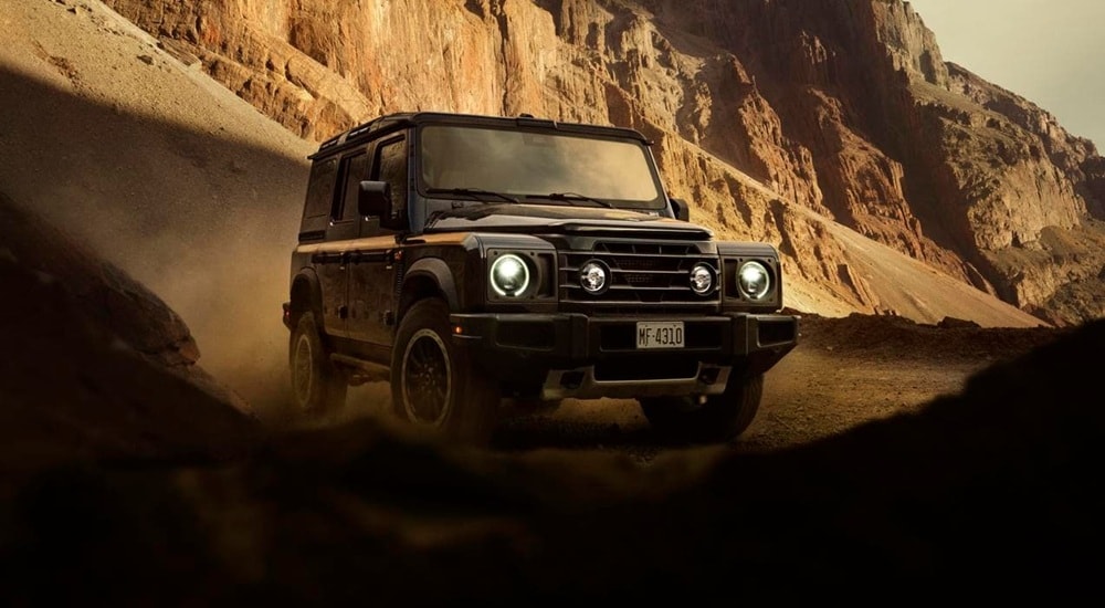 Black 2025 INEOS Grenadier driving off-road.