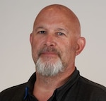Staff member JOHN GREGG from ID_0db9f87185c1