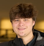 Staff member Carter Jones from ID_f5e3f35c494f