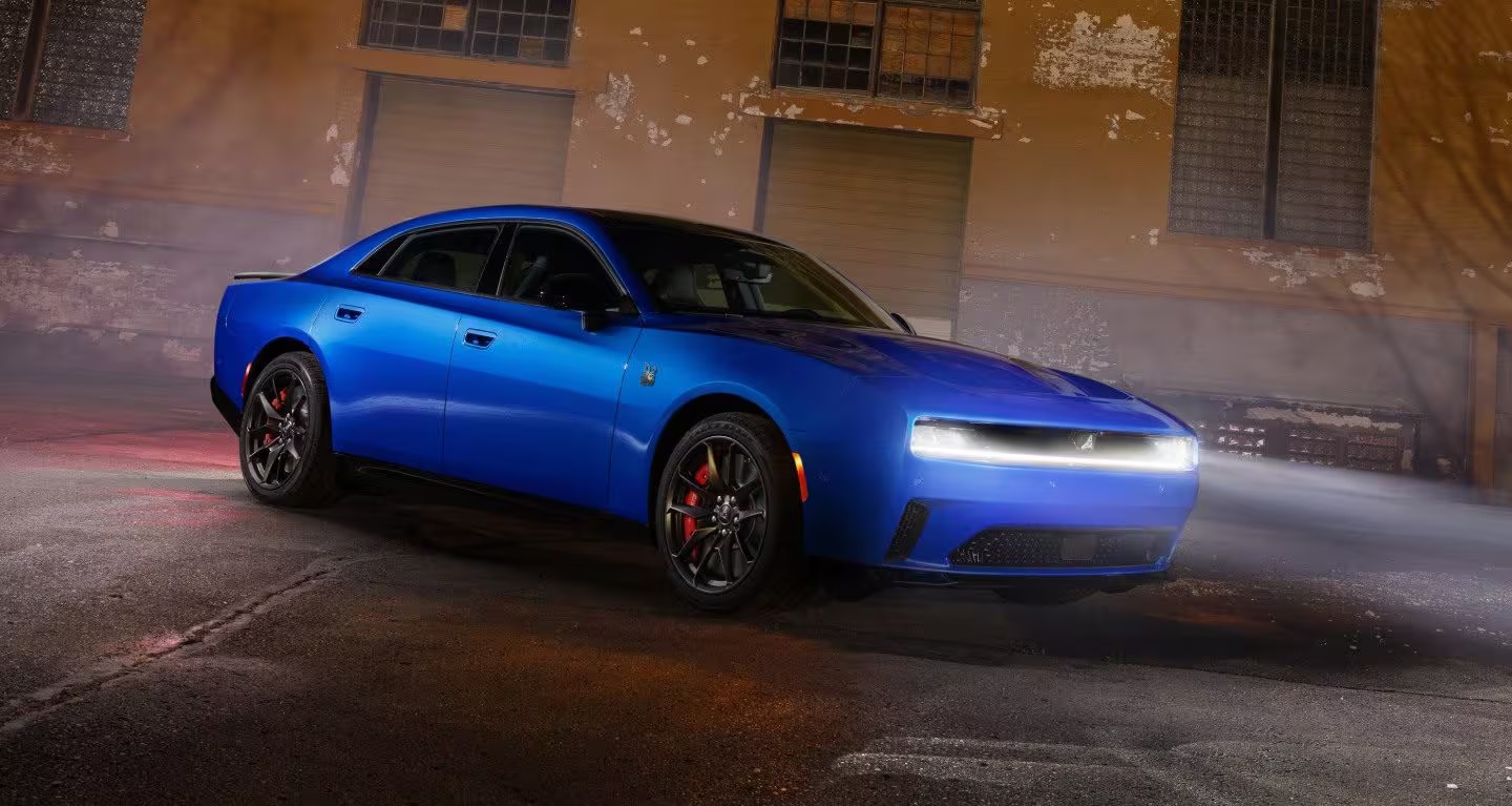 2026 Dodge Charger Daytona Sedan on asphalt at night with headlights on