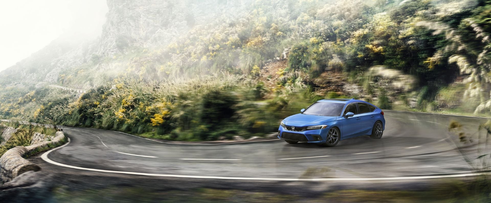 2023-Honda-Civic-Hatchback-Sport Touring-CurvedRoad-web.jpg