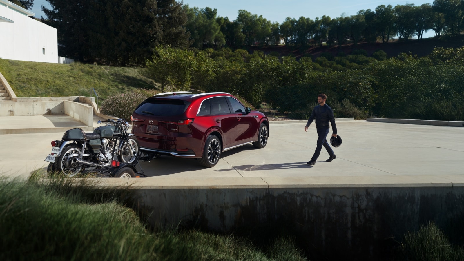 2026-mazda-cx-90-trailering-motorbikes-man.png