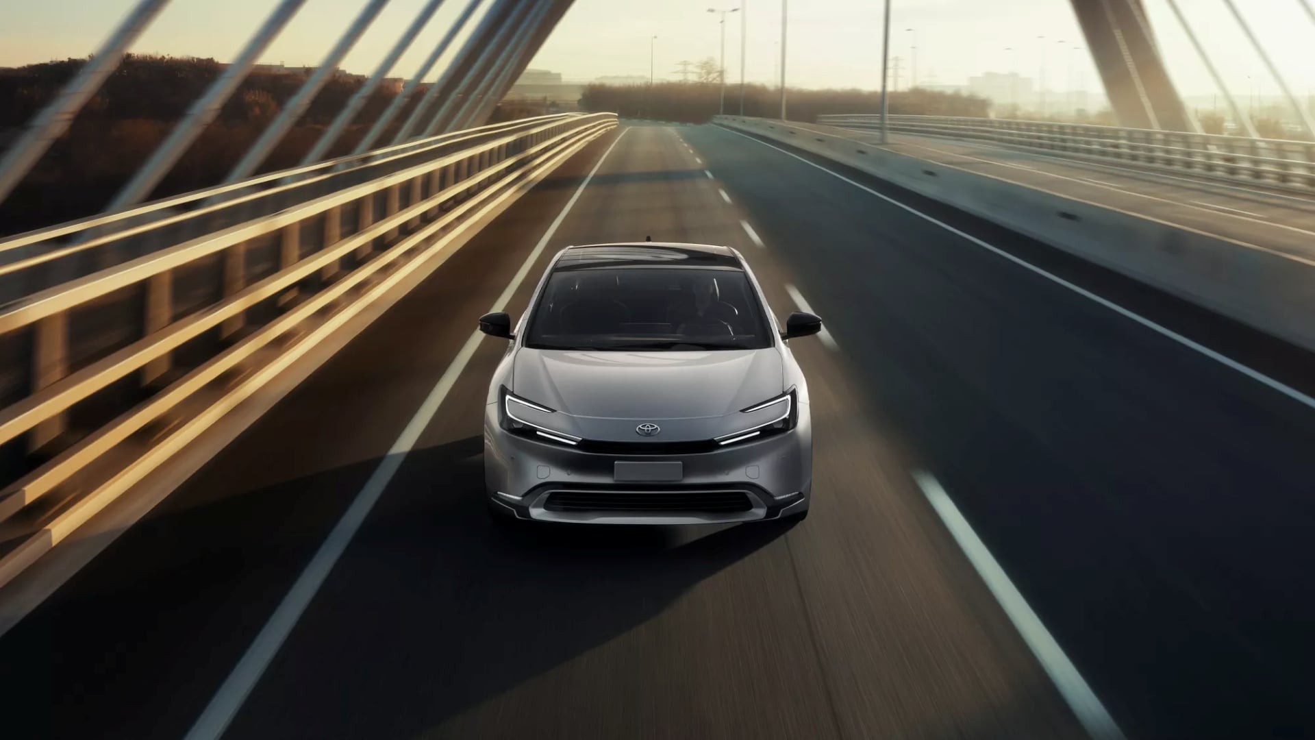 2025-toyota-prius-phev-driving-on-highway-over-bridge.png