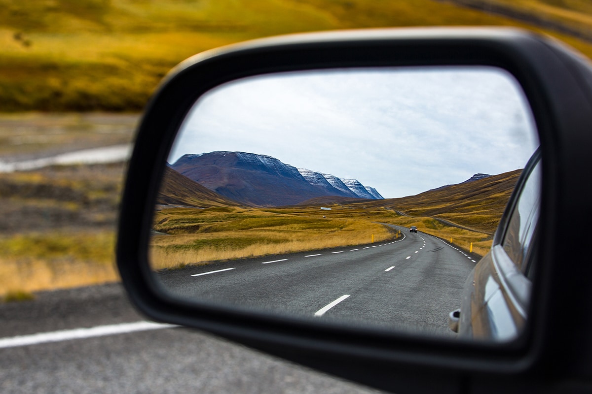 View of the road from a vehicle's side mirror