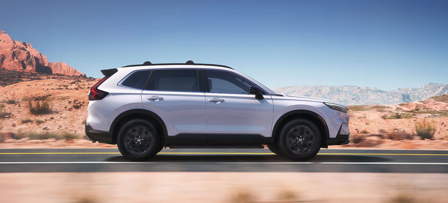 A white 2023 Honda CR-V in profile view