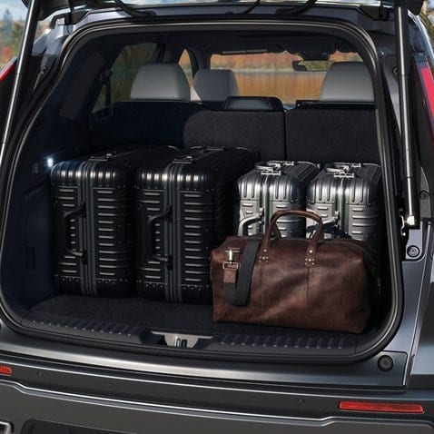 Honda CR-V rear cargo area loaded with luggage and a duffel bag